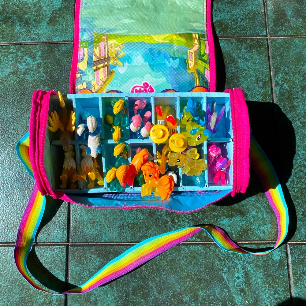 My little pony collection with bag and play area.